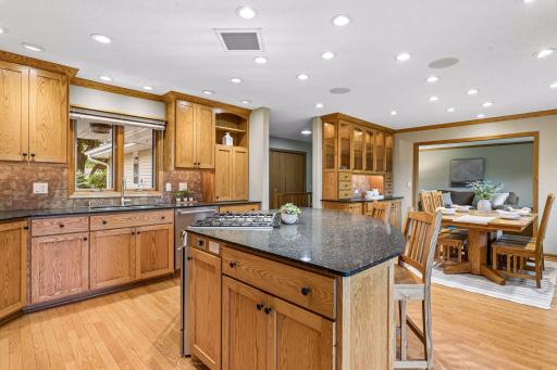 The large center island with granite counters is a great space for breakfast, snacks, and serving the kiddos.