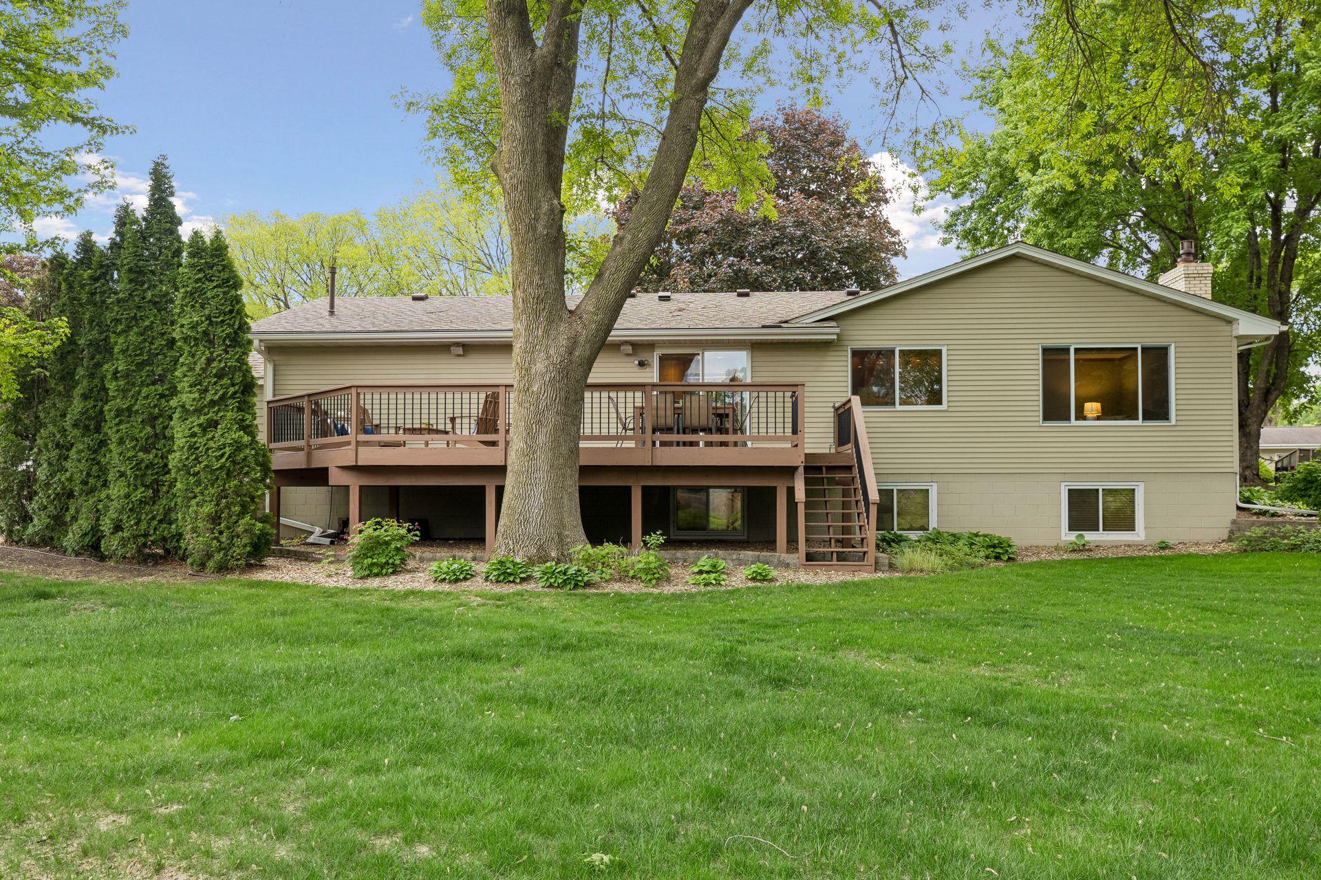 Back of home with expansive deck.