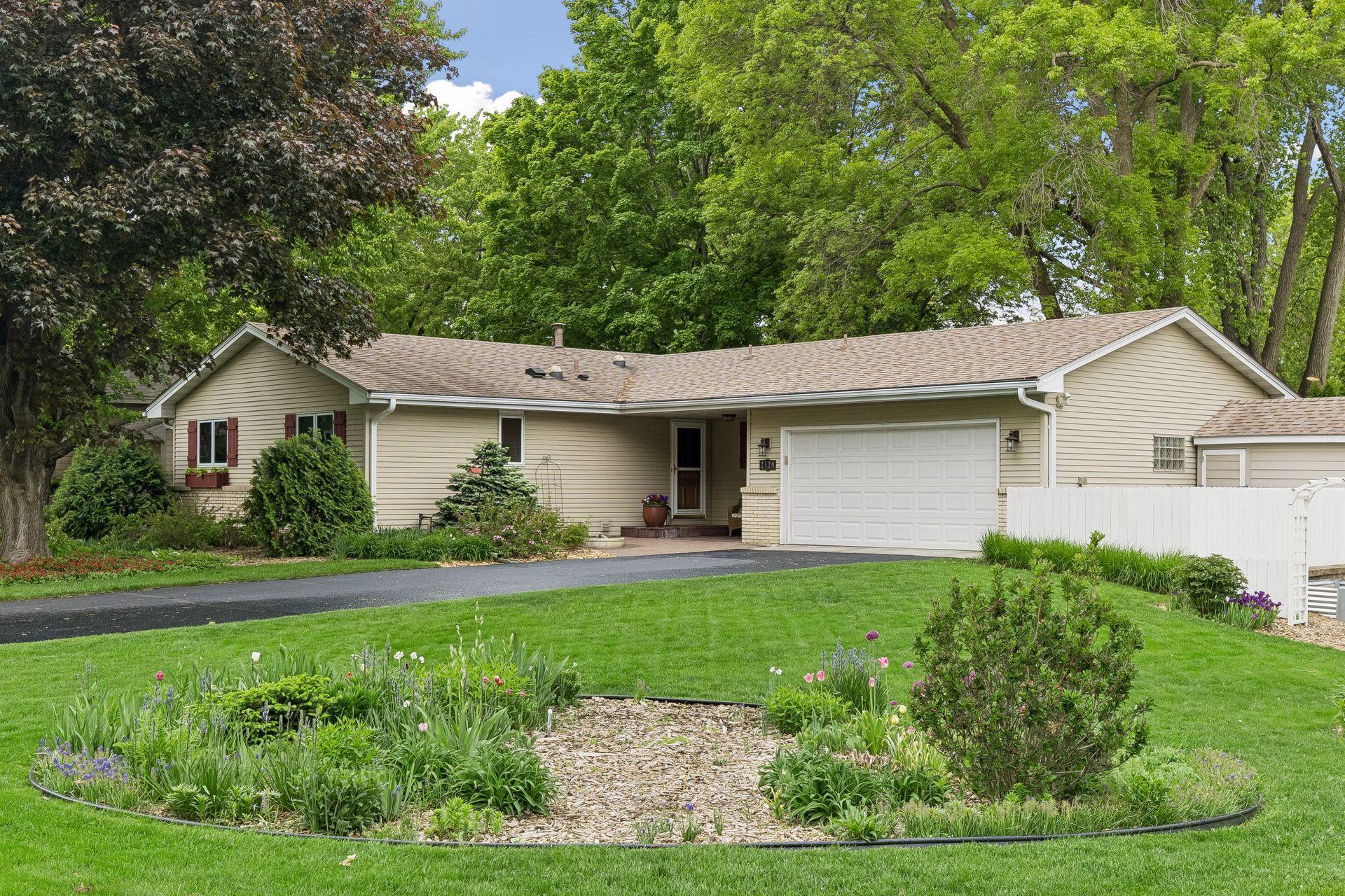 Beautifully landscaped yard and newly resurfaced driveway.