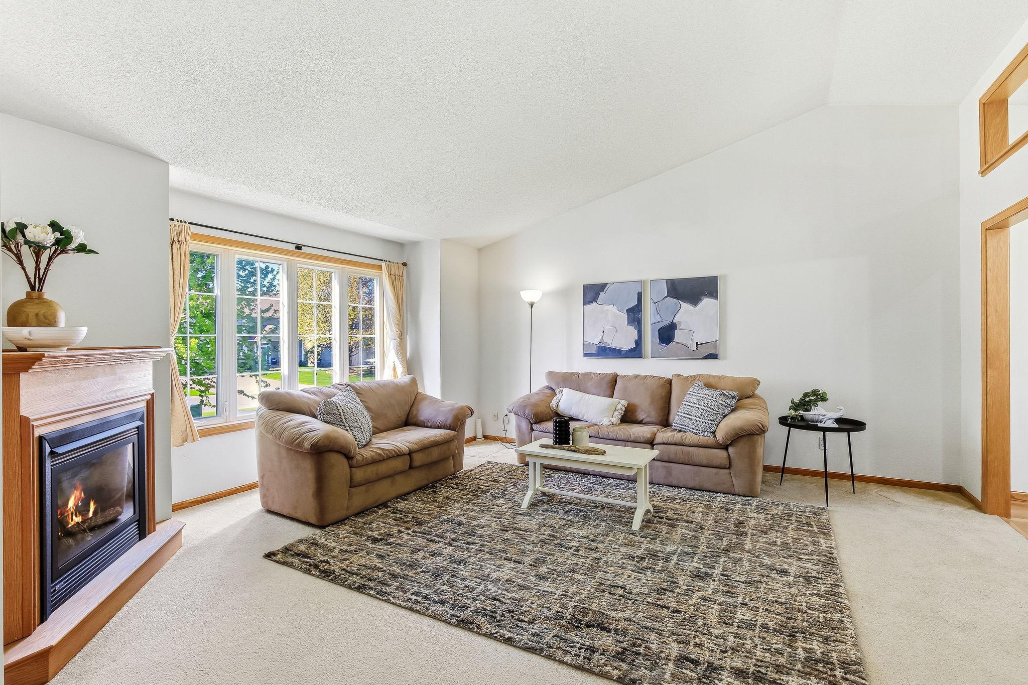 LIVING ROOM WITH COZY FIREPLACE