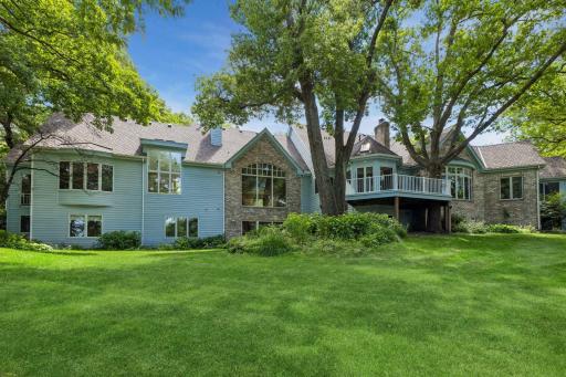 Timeless Architecture, classic brick and cedar exterior, exceptional craftsmanship, and thoughtfully designed outdoor living spaces complement the home's spectacular natural setting.