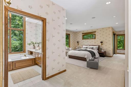 Your Own Private Retreat, wake each morning to peaceful pond views from the spacious Owner's Suite, complete with a sitting area and spa-like bath. Virtual staging