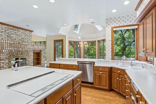 Kitchen with Scenic Views, designed for everyday living and entertaining, the Kitchen offers generous workspace, a center island, walk-in pantry, and a Dinette overlooking the surrounding nature.