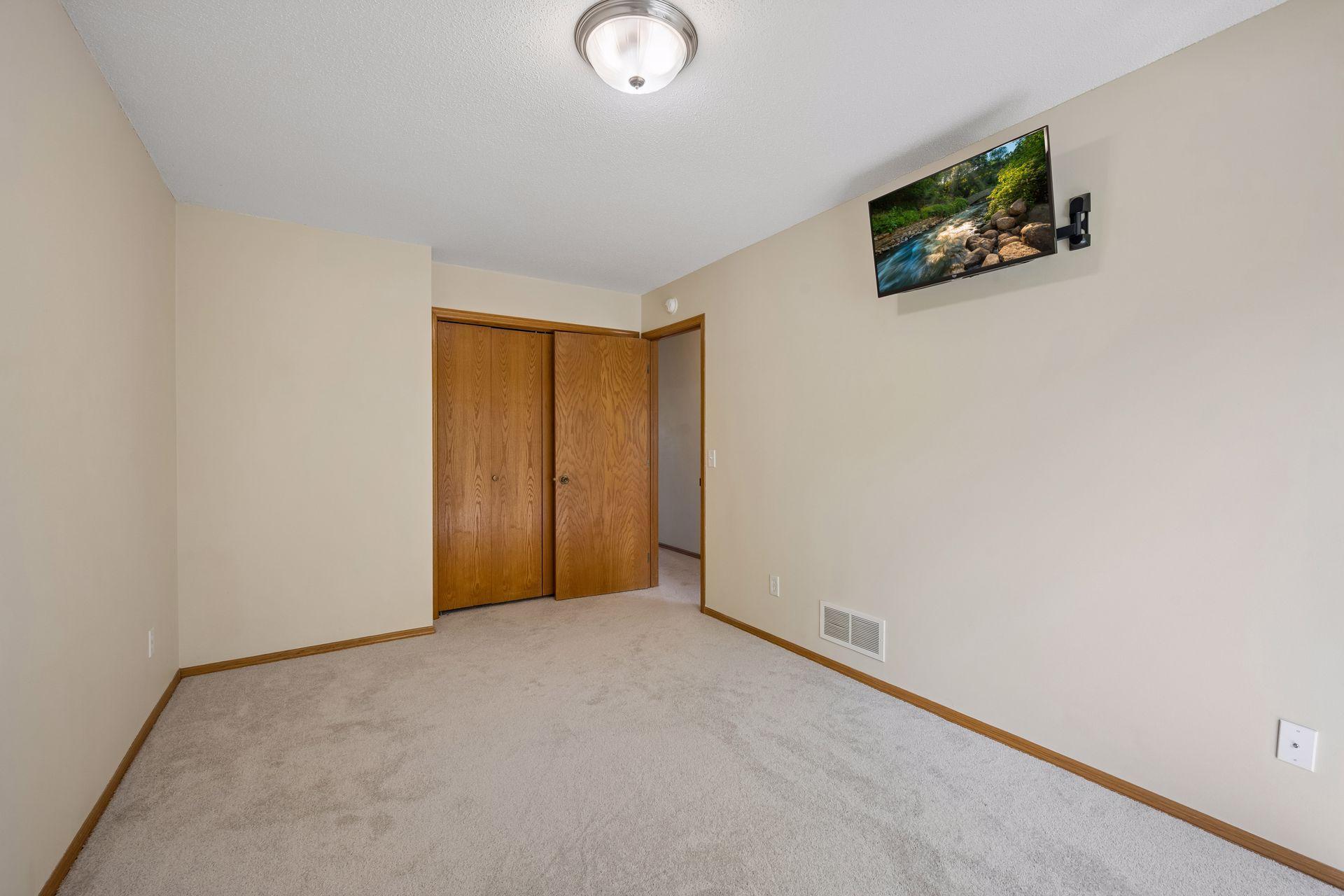Upper bedroom on right with extra storage nook in the left side of the closet