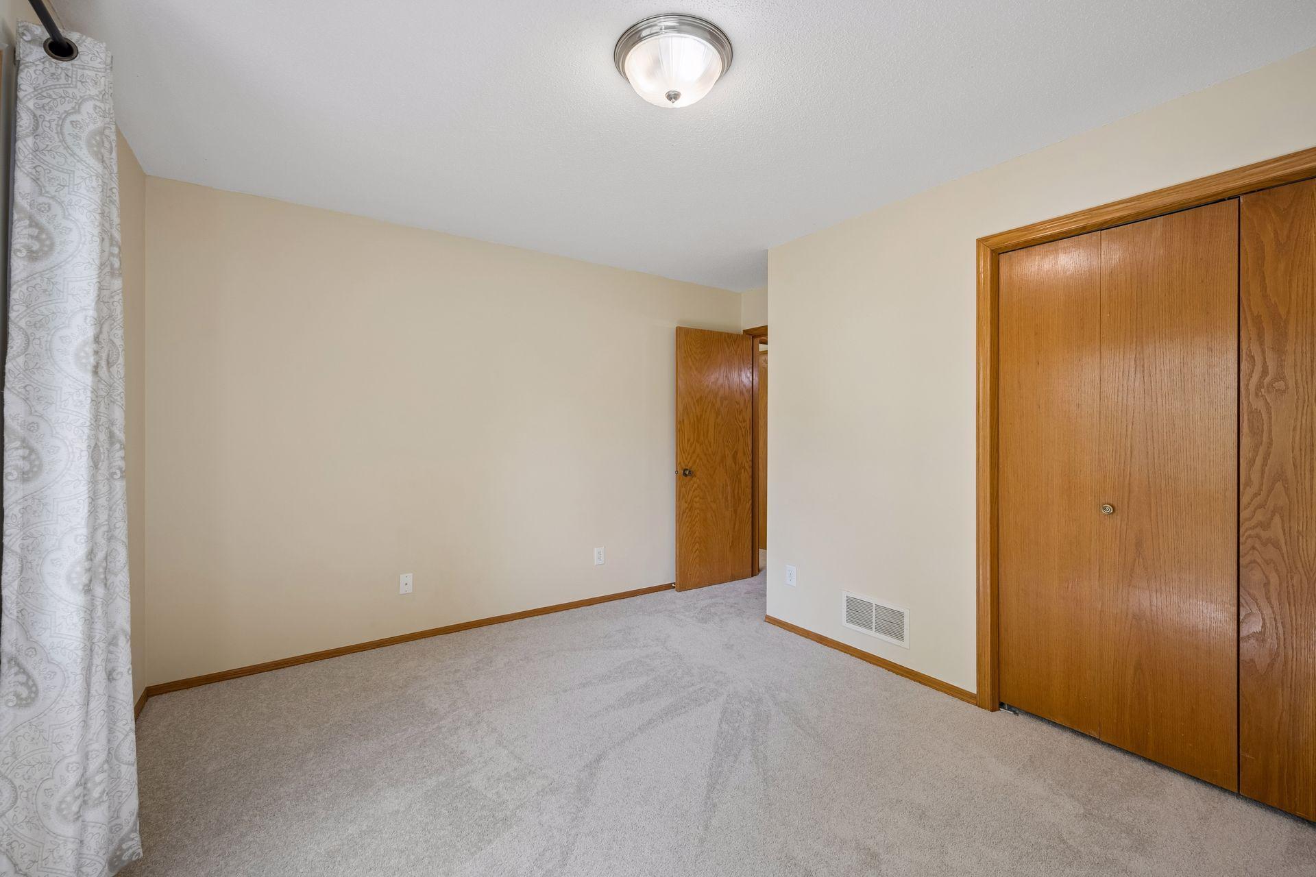 Upper bedroom on left showing the closet