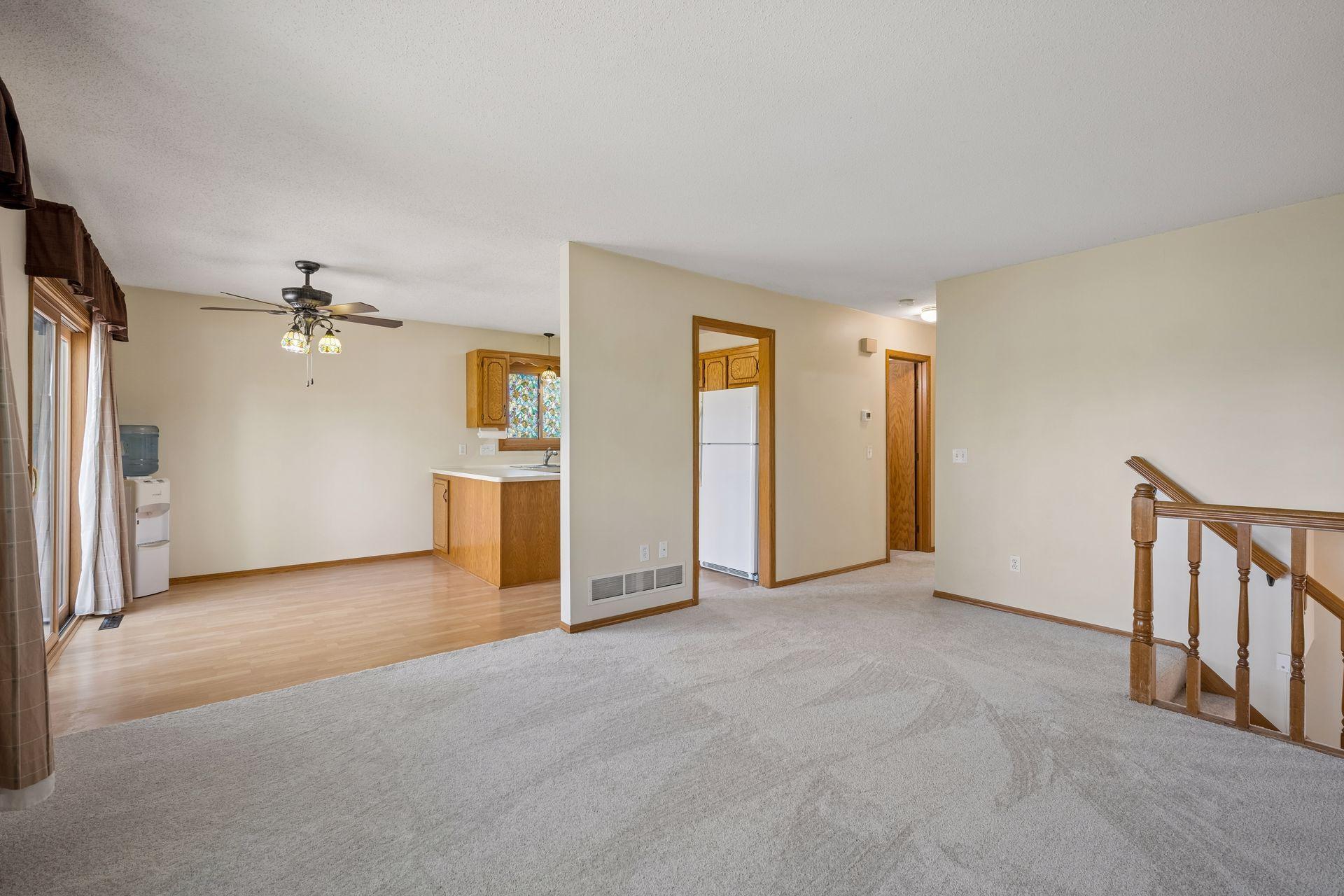 Living room with dining and kitchen in the background