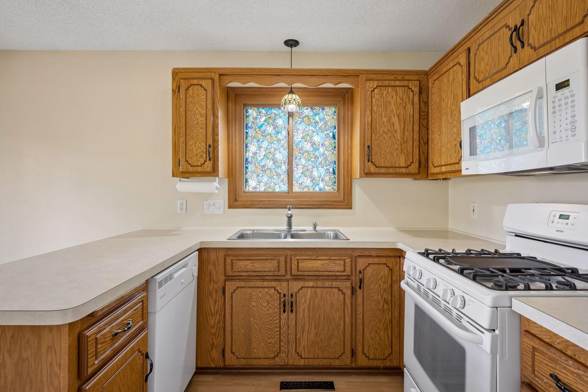 Kitchen area with newer dishwasher installed in 2019