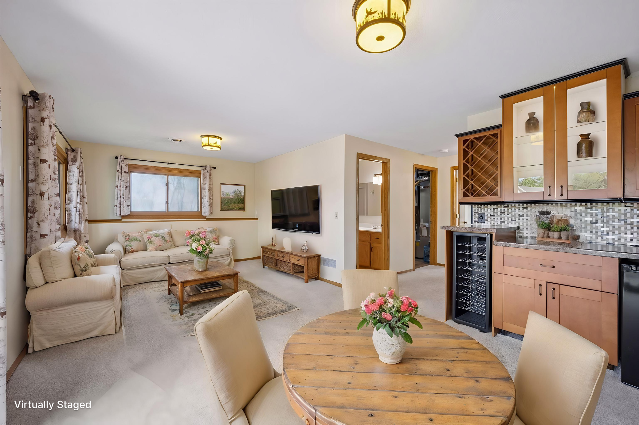 Lower level bar area and family room virtually staged