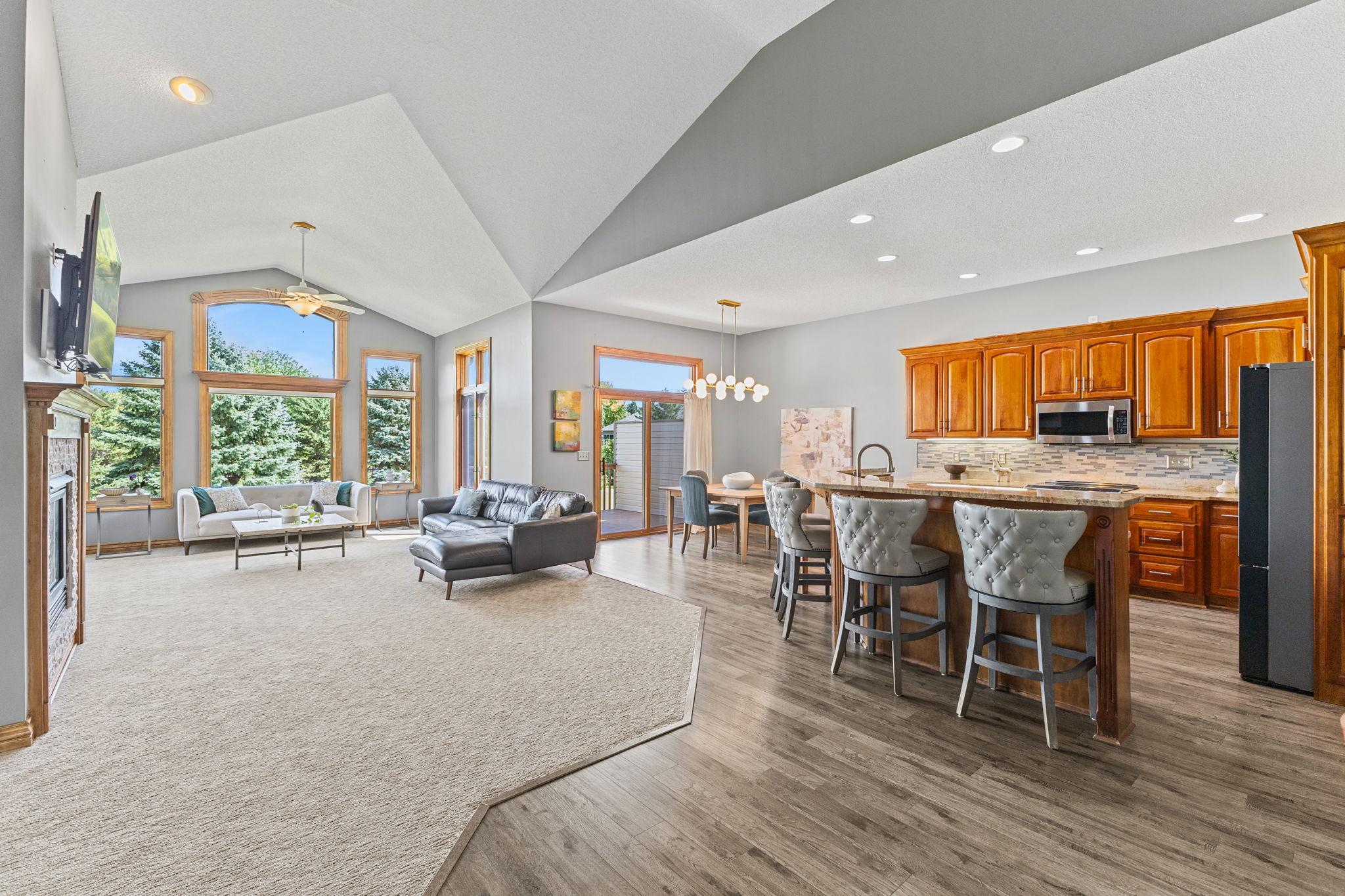 Soaring vaulted ceilings and an open concept floor plan offer an incredibly spacious feel to the main level. Generous living space provides a perfect area to host lively family gatherings with plenty of room for extended family and friends!