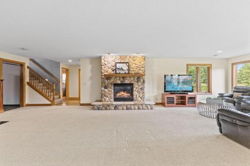 Wide open with an amazing focal point! This stone surround gas fireplace & hearth provides that grand lodge feel.