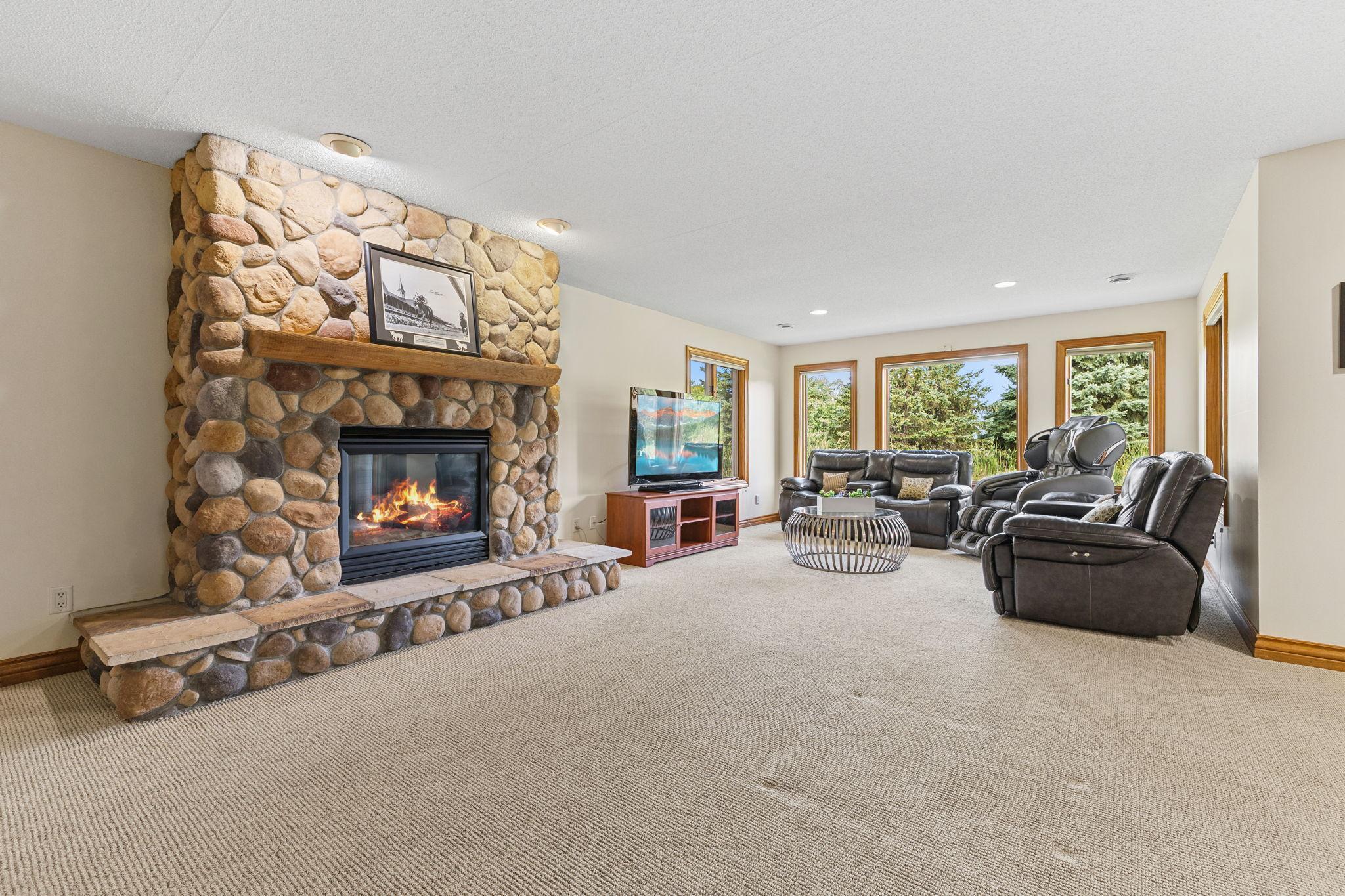 Not quite ready to give up that lower level yet? Well you don't have to! The spacious lower level offers a huge family entertainment room for family, grandkids and friend entertaining!