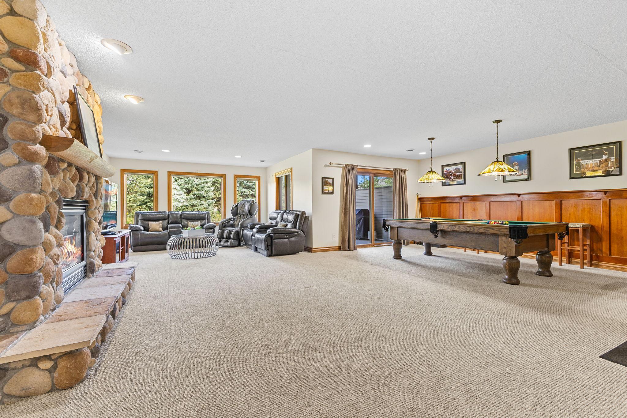 The executive feeling space of this level with the high end finishes & paneled walls will make you proud to host family and friends for holidays or the big game days!