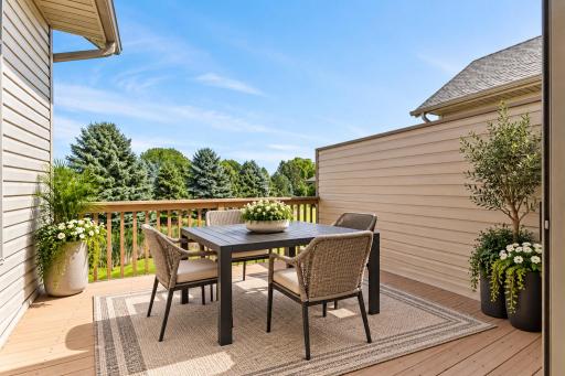 Peaceful morning coffee or evening diners all summer long overlooking your natural backdrop as this virtually staged space shows. The maintainence free deck floor offers years of enjoyment.