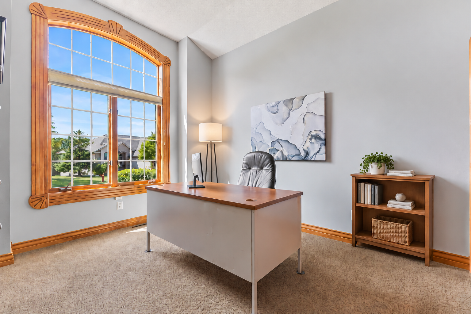 Adjacent to the entryway, this room could be used as a second bedroom on the man level or ideal home office. The oversized window allows natural light to fill the room! 10' ceilings, neutral carpet and professionally painted walls are a big bonus.