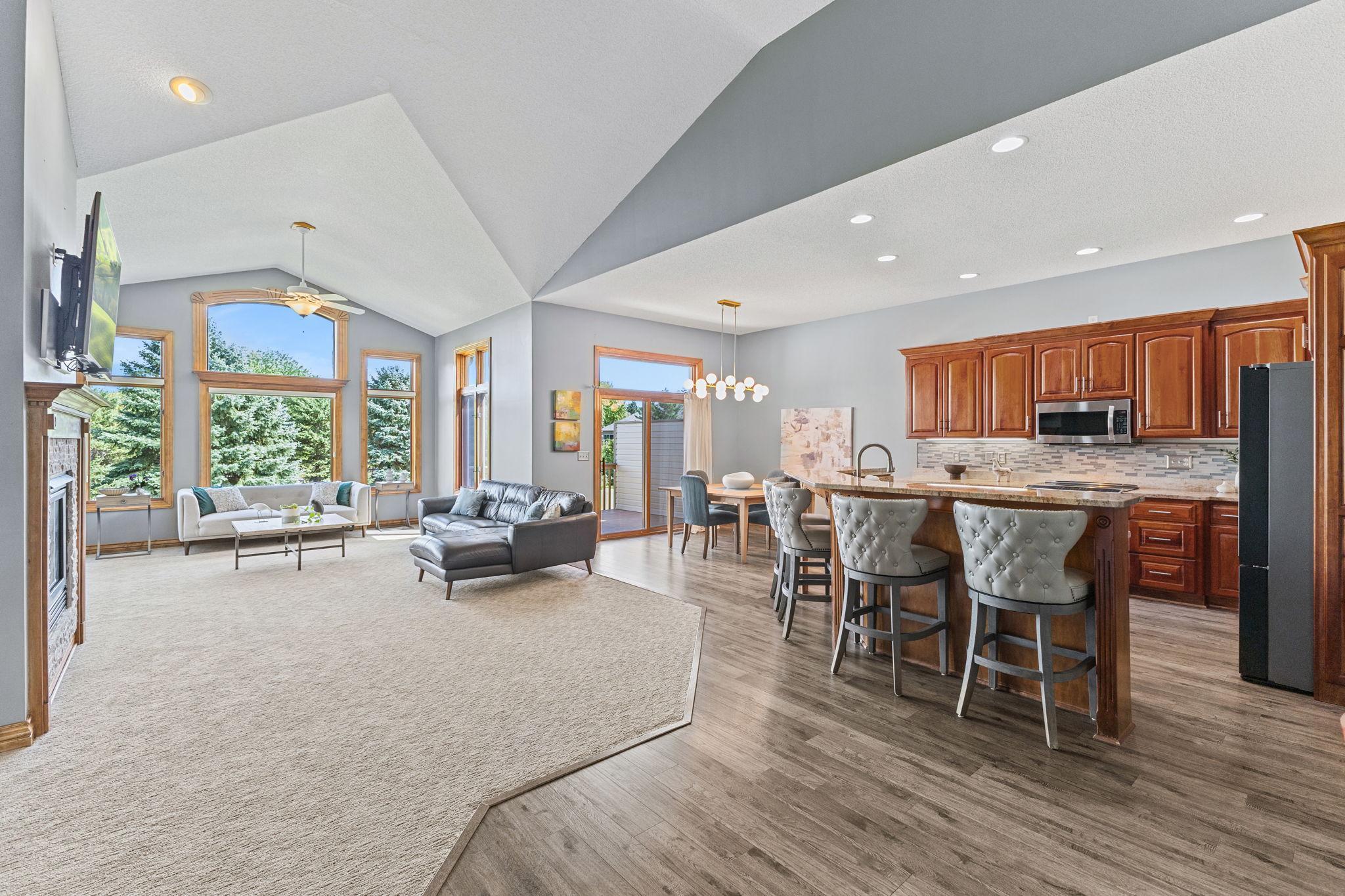 Soaring vaulted ceilings and an open concept floor plan offer an incredibly spacious feel to the main level. Generous living space is ideal for entertaining with festive family gatherings and plenty of room for extended family and friends!