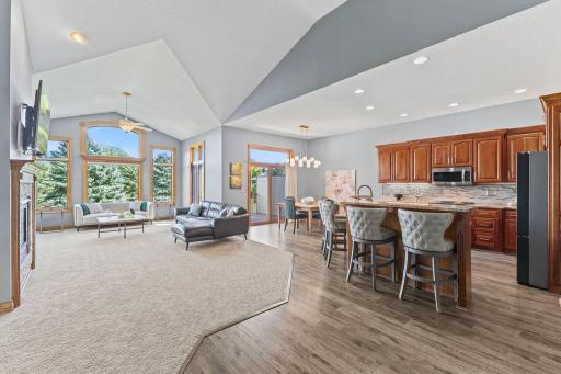 Soaring vaulted ceilings and an open concept floor plan offer an incredibly spacious feel to the main level. Generous living space is ideal for entertaining with festive family gatherings and plenty of room for extended family and friends!