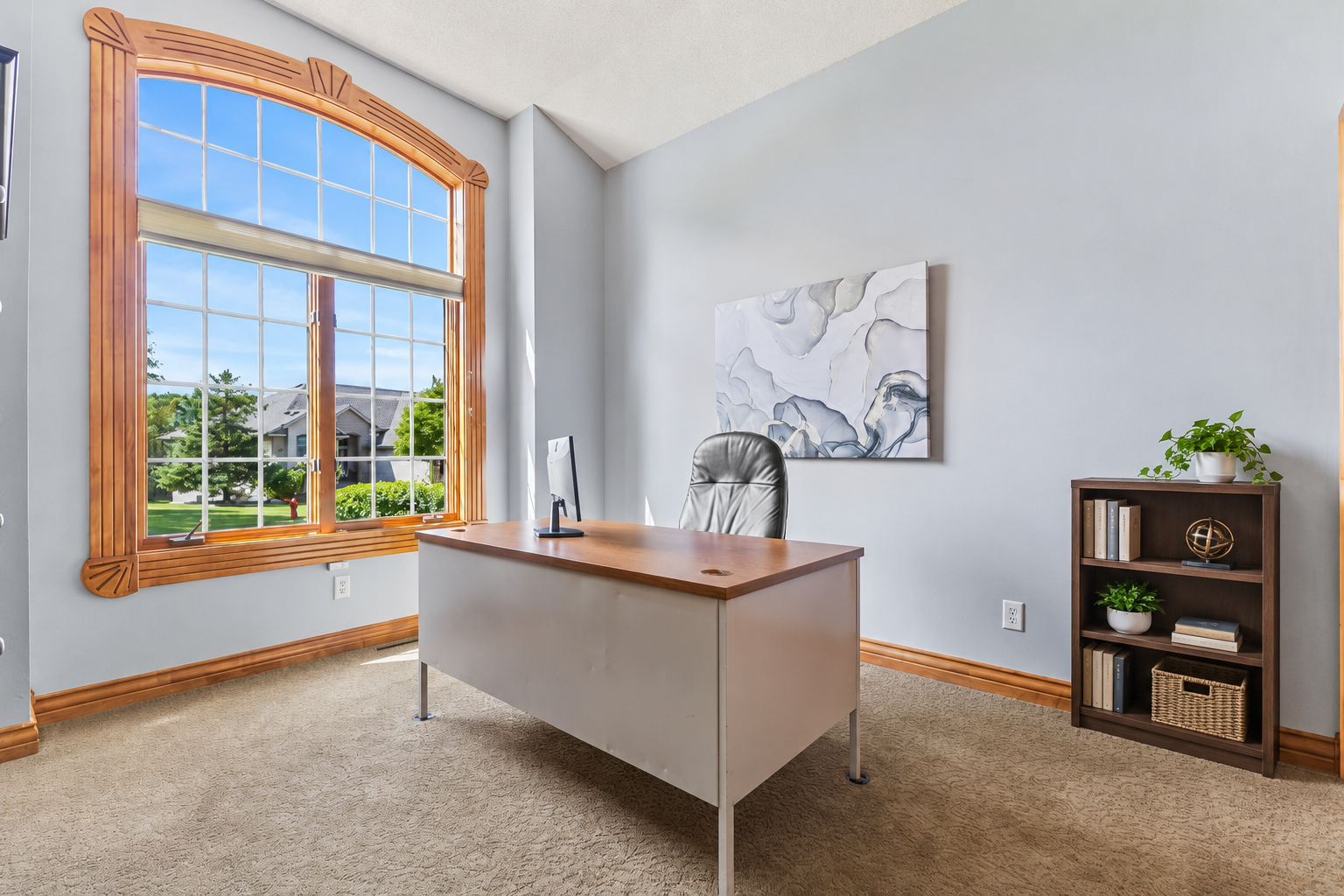 Adjacent to the entryway, this room could be used as a second bedroom on the main level or ideal home office. The oversized window allows natural light to fill the room! 10' ceilings, neutral carpet and professionally painted walls are a big bonus.