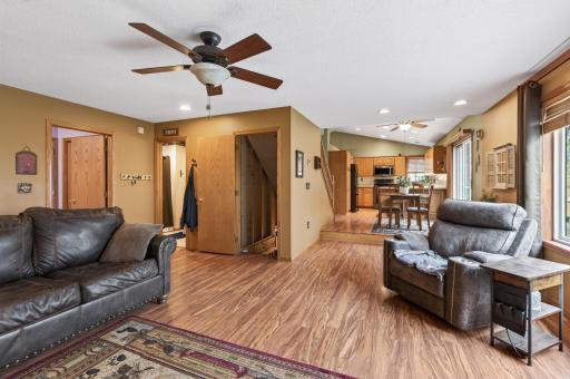 Family room showing stairway down, bathroom and doorway to laundry room