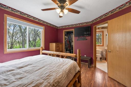 Primary bedroom features a walk in closet and access to walk through bathroom