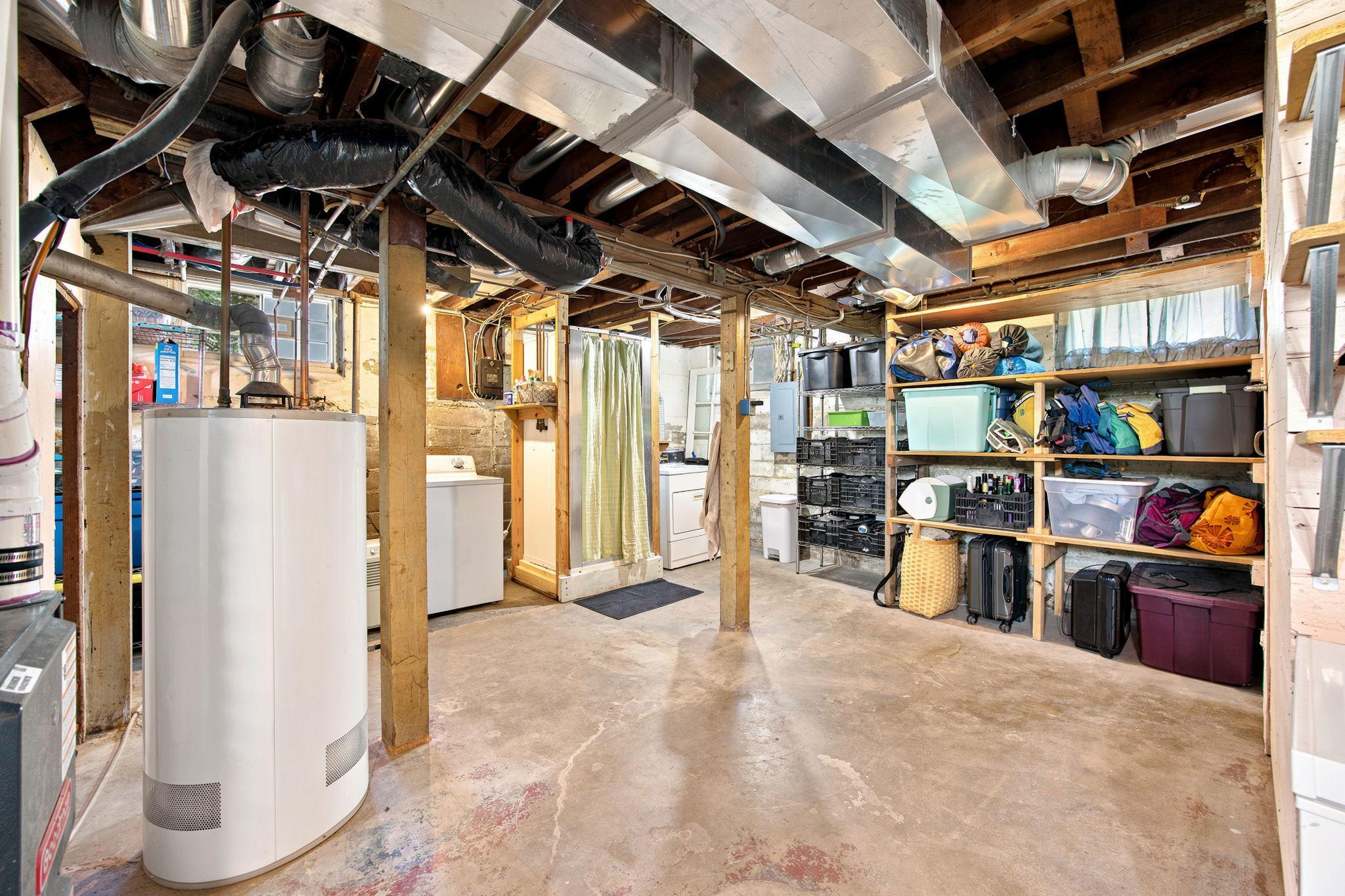 Basement with built-in wooden shelves (freestanding metal shelving excluded)