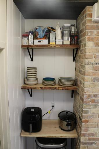 Exposed brick is original fireplace chimney