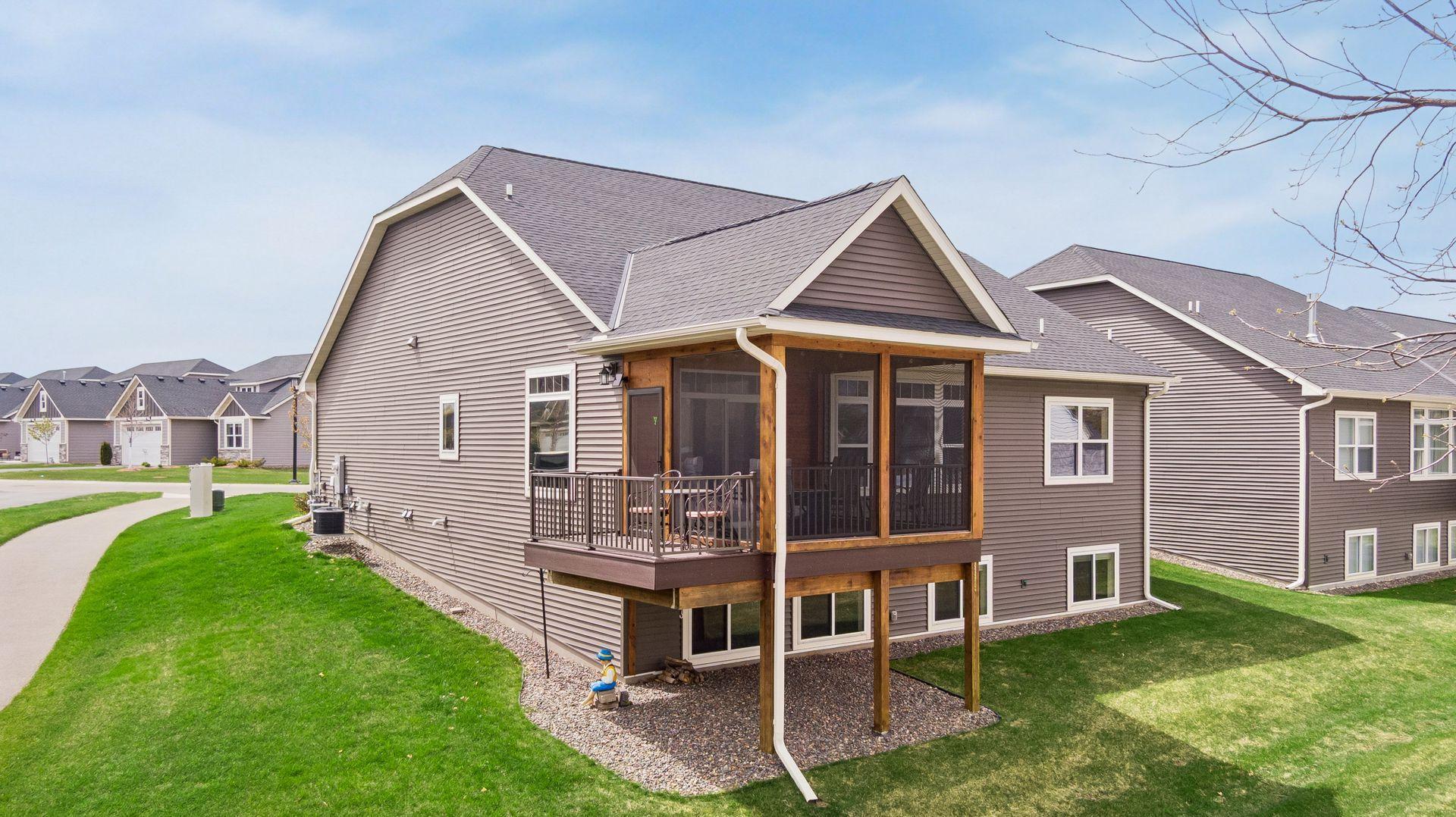 Screened porch with grill/sitting deck overlooking the lake.