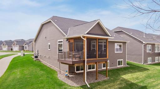 Screened porch with grill/sitting deck overlooking the lake.