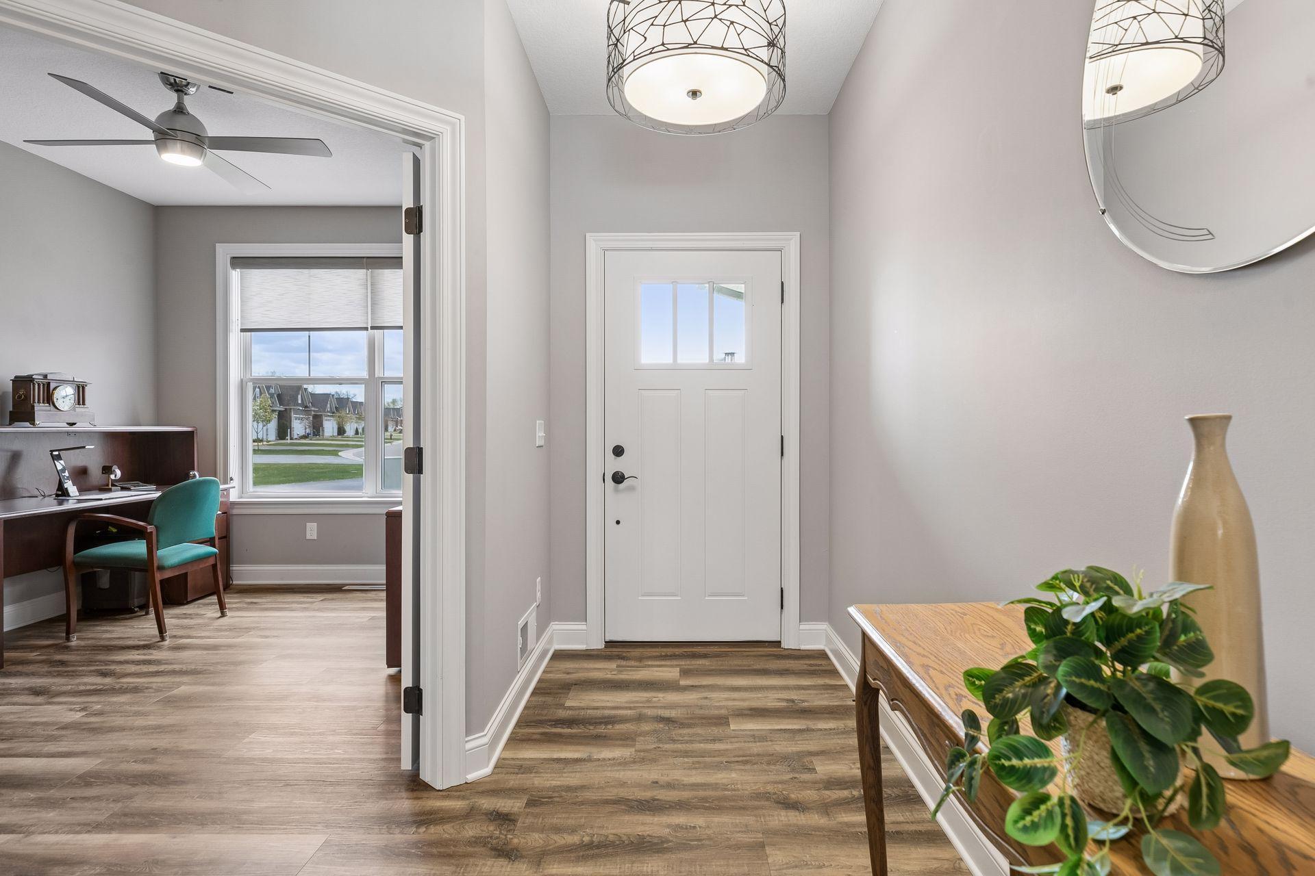 Front entry with double doors leading to front office/bedroom.