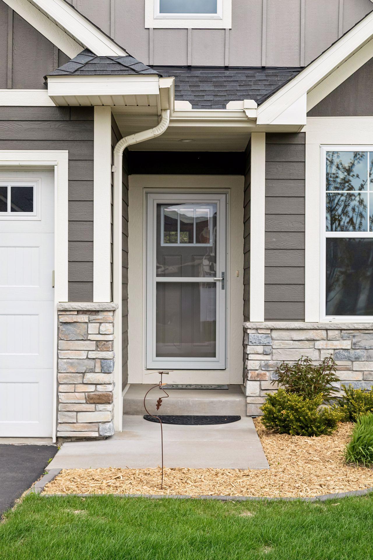 Welcoming front entry. Screen door is ideal for when the weather warms up.