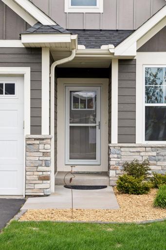Welcoming front entry. Screen door is ideal for when the weather warms up.