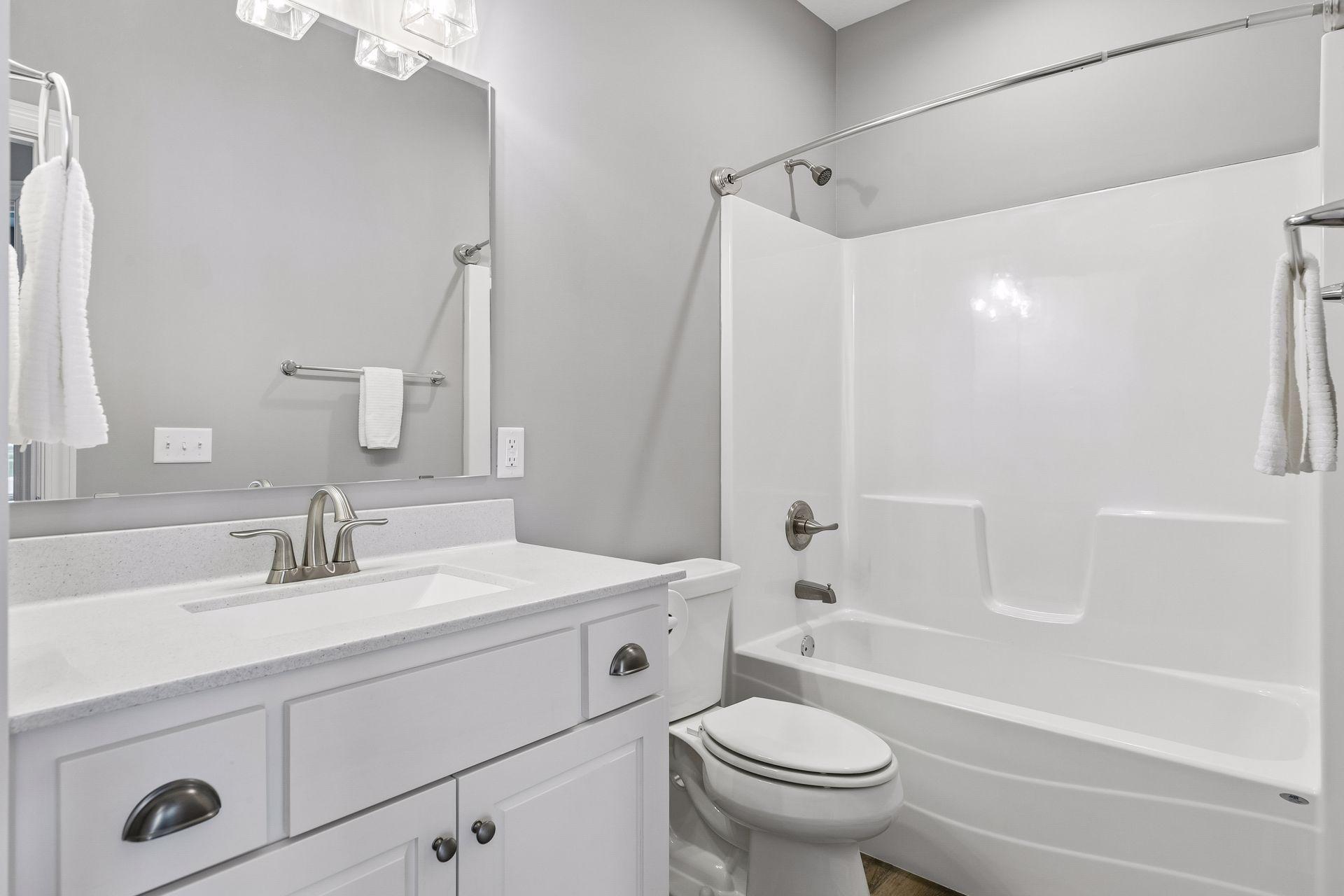 Main level full bath is conveniently located across the hall from the 2nd Bedroom/Office.