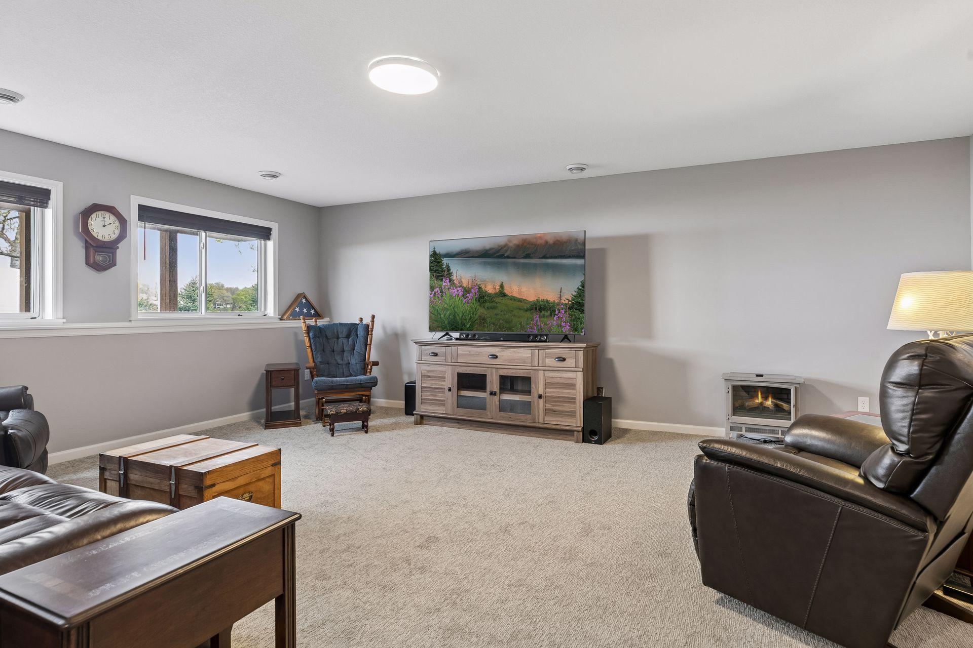 Lower level Family Room - plenty of space to spread out to entertain large groups or cozy up and watch a game.