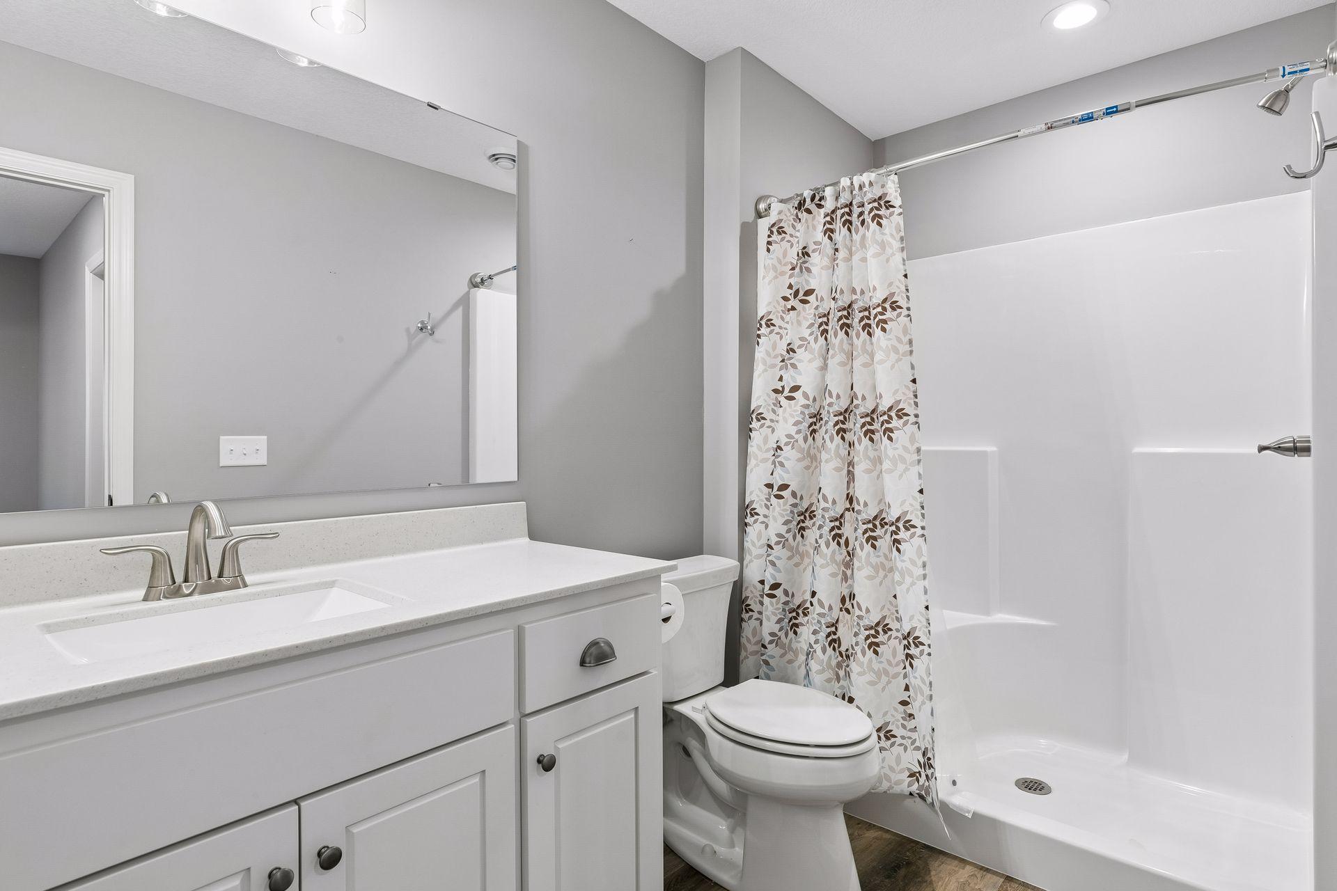 Lower level 3/4 bath. There is a large seasonal walk-in closet outside this room as well. Home is not lacking storage.