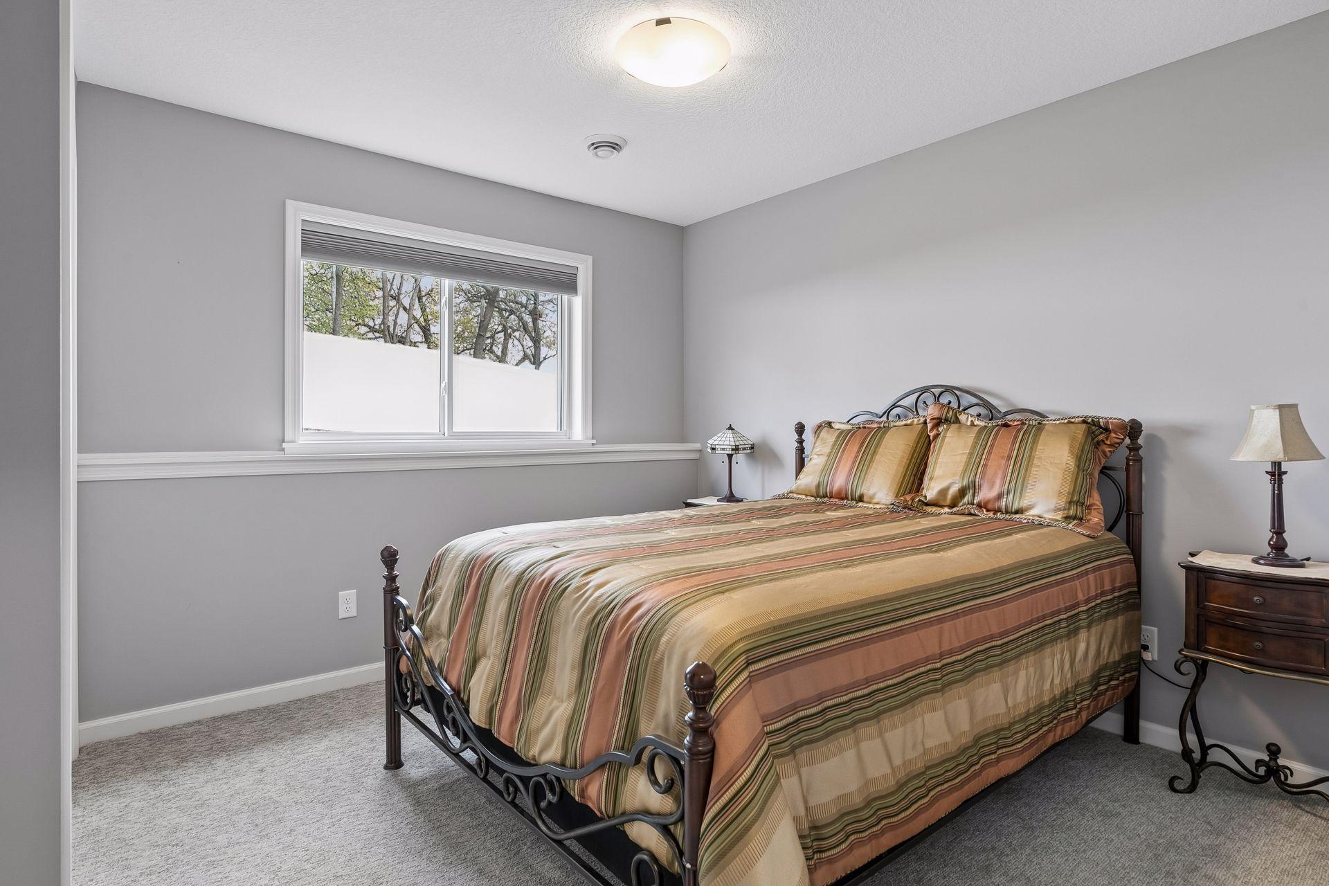 Lower level bedroom with generous closet space.