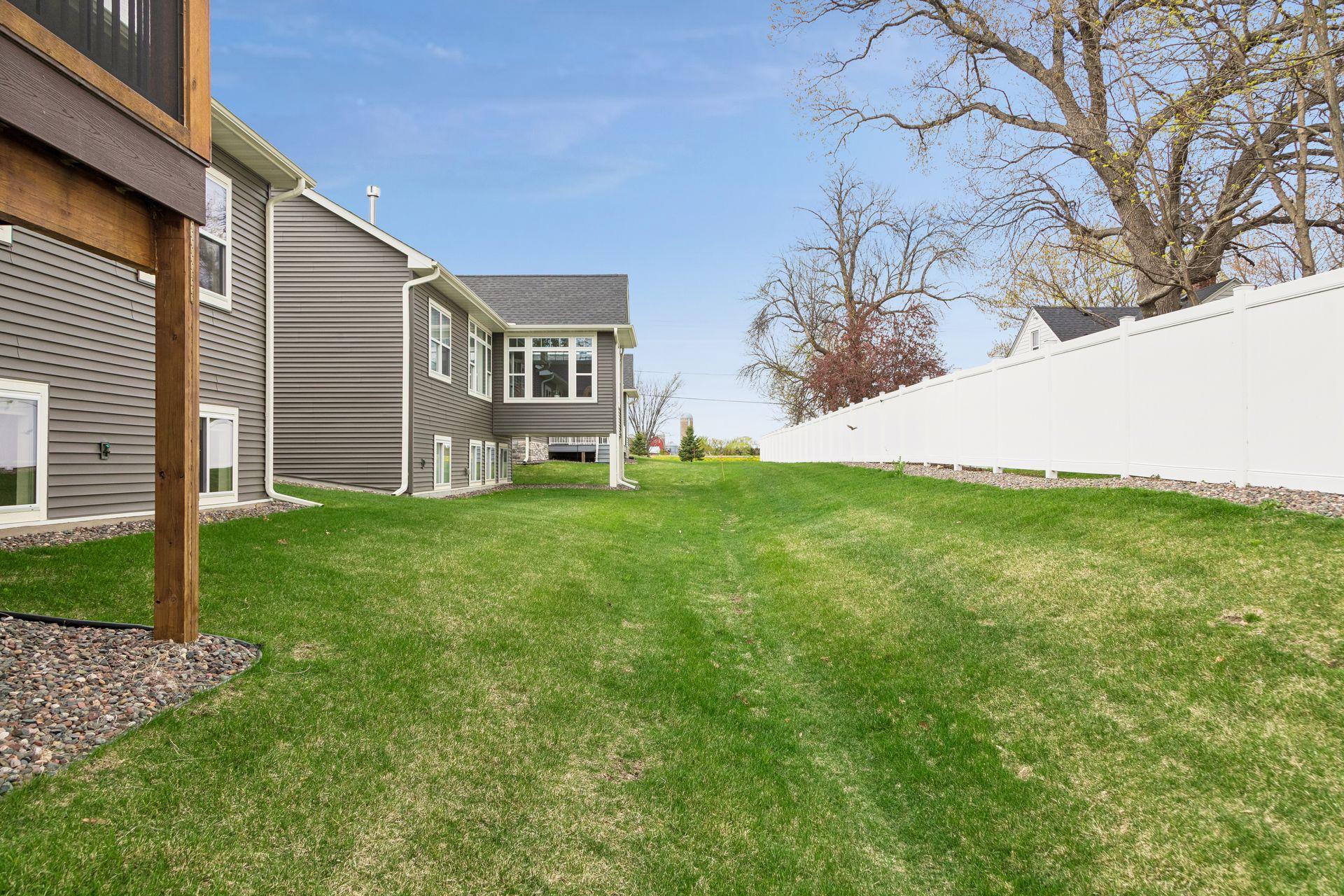 Association privacy fence creates a nice defined space. Lawns are irrigated with water from the lake and included in the HOA dues.