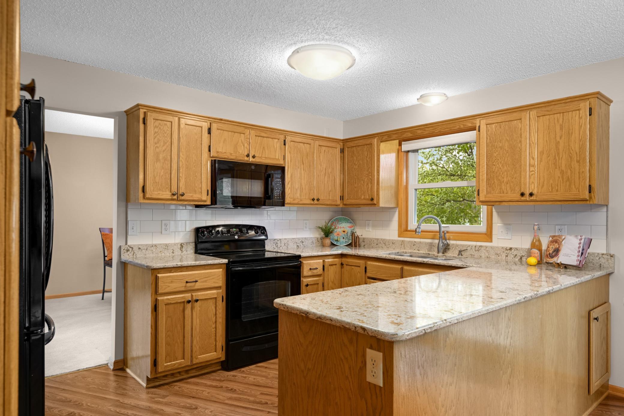Kitchen with window to the backyard.