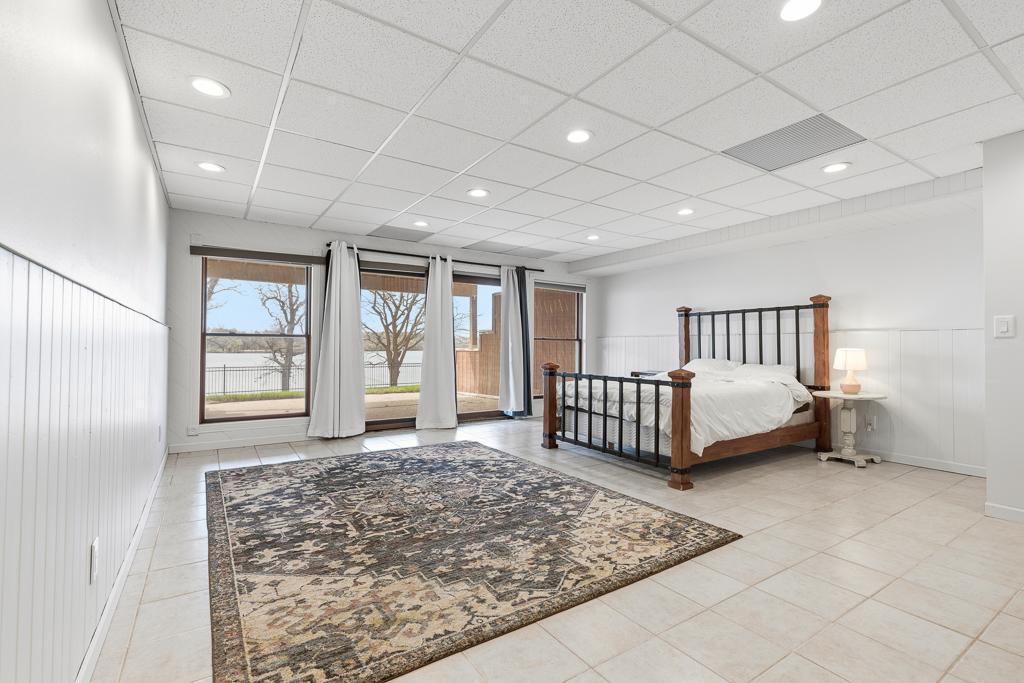 Tile floors, recessed lighting, walkout, large windows for natural light, and more!