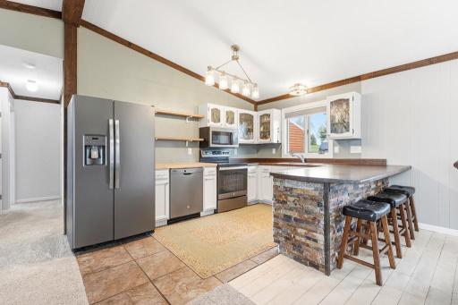 Updated stainless steel appliances, nicely located kitchen window, and a large island!