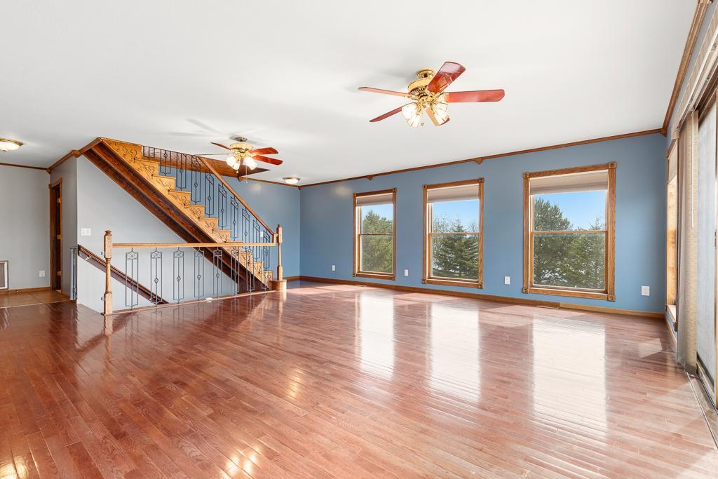 Staircase leads to the upper-level suite and to the lower-level walkout space