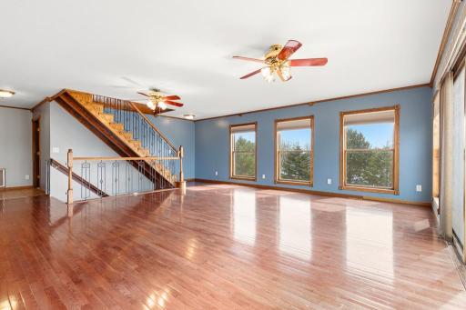 Staircase leads to the upper-level suite and to the lower-level walkout space