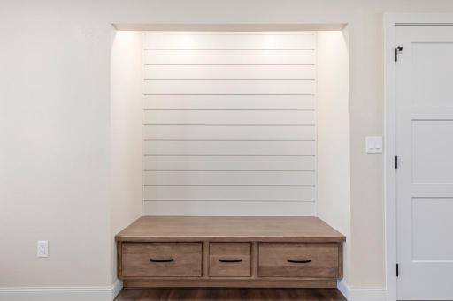 The perfect spot for guests to take a seat, remove their shoes, and stare at your new home in awe!