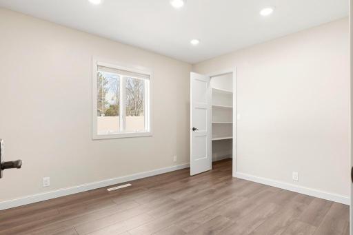 Main floor bedroom space with a walk-in closet.
