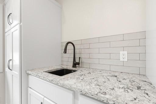 This sink in the main floor laundry room is a great addition that will come in handy!
