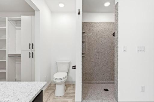 Beautifully designed walk-in shower with an Onyx surround. Easy to clean and long lasting!