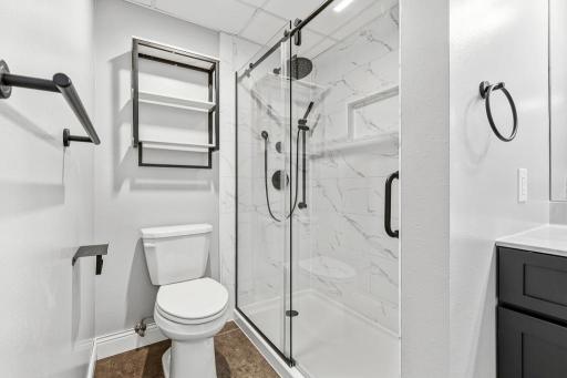 Nicely designed walk-in shower with glass doors