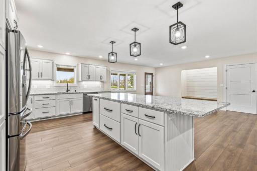 Special pullouts in the island include a dedicated trash/recycling pullout and LARGE, deep drawers for all your kitchen cookware needs.