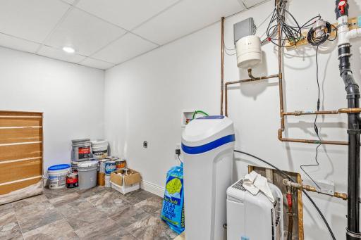 Mechanical room - owned water softener, owned reverse osmosis, sump pump siphon water system, great storage space, AND another set of washer & dryer hookups!