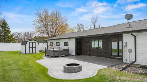 Nicely designed stamped concrete patio that features direct access to the garage and also the interior of the home.
