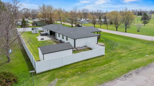 LARGE corner lot! Check out the FULL vinyl privacy fence with multiple exterior gates and access to the backyard from either side of the yard.