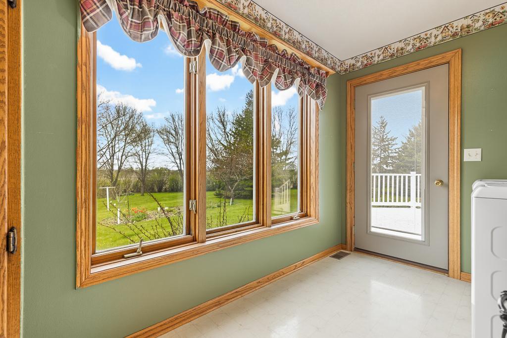 MAIN FLOOR dedicated laundry room with direct access to the back deck as well.